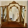 DM04. Trifold gilt vanity mirror. 